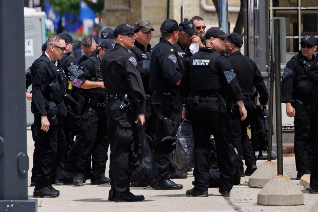 Officers walk outside the Fiserv Forum before the first day of the Republican National Convention on July 14, 2024, in Milwaukee. (Armando L. Sanchez/Chicago Tribune)