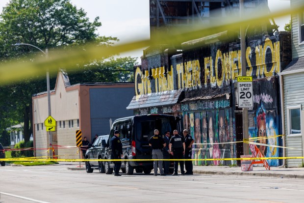 Officers investigate the scene where police from Columbus, Ohio, fatally shot a man near the intersection of North 14th Street and West Vliet Street, approximately a mile from the Republican National Convention, on July 16, 2024, in Milwaukee. (Armando L. Sanchez/Chicago Tribune)