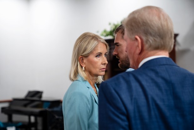 U.S. Rep Mary Miller, 15th District, confers with her deputy chief of staff William Wadsworth before briefly speaking to the press after the Illinois Republican Party Delegation Breakfast in Oak Creek, Wisconsin on July 16, 2024. (E. Jason Wambsgans/Chicago Tribune)