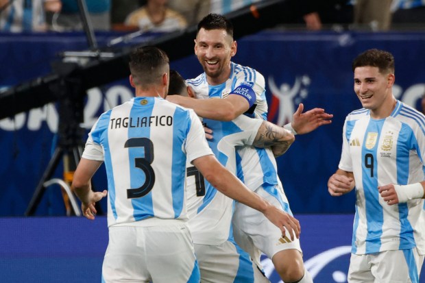 Lionel Messi, top middle, celebrates with teammates after scoring Argentina's second goal during a Copa America semifinal against Canada on Tuesday, July 9, 2024, in East Rutherford, N.J. (Eduardo Munoz/AFP/Getty Images/TNS)