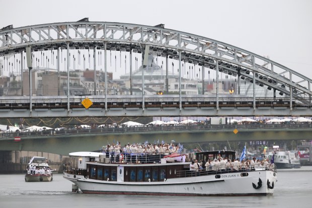 The first boat of the 2024 Summer Olympics opening ceremony parade is Greece as it travels along the Seine River on July 26, 2024, in Paris, France.