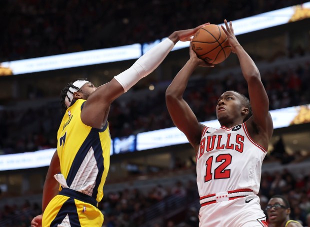 Pacers guard Buddy Hield blocks a shot by Bulls guard Ayo Dosunmu in the first quarter Dec. 28, 2023, at the United Center. (Brian Cassella/Chicago Tribune)