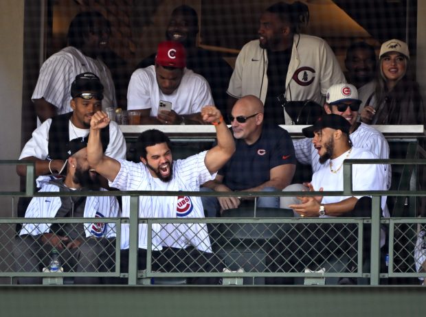 Chicago Bears quarterback Caleb Williams reacts to the fans cheers after he appeared on the video board during a game between the Chicago Cubs and the Milwaukee Brewers at Wrigley Field on May 4, 2024. (Nuccio DiNuzzo/Getty)