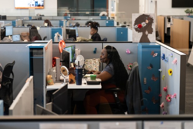 Olivia McMorris handles a call in Discover's three-year-old call center in the Chatham neighborhood, July 18, 2024. (E. Jason Wambsgans/Chicago Tribune)