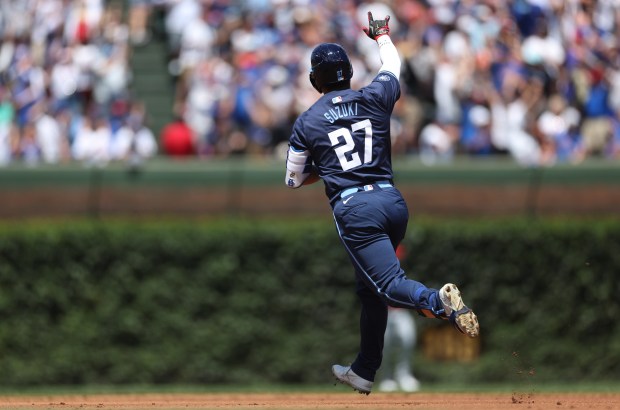 Cubs right fielder Seiya Suzuki celebrates as he rounds the bases after hitting a two-run home run in the first inning on July 5, 2024, at Wrigley Field. (Chris Sweda/Chicago Tribune)