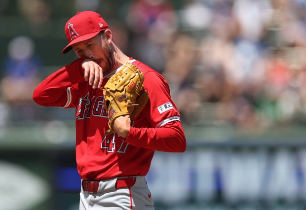 Angels starter Griffin Canning wipes his face in the first inning on July 5, 2024, at Wrigley Field. (Chris Sweda/Chicago Tribune)