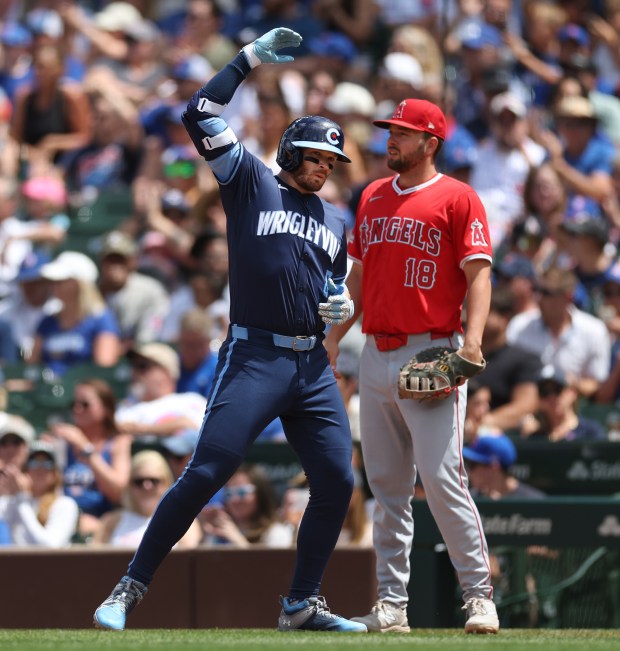 Cubs left fielder Ian Happ celebrates after driving in a run with a single in the third inning on July 5, 2024, at Wrigley Field. (Chris Sweda/Chicago Tribune)