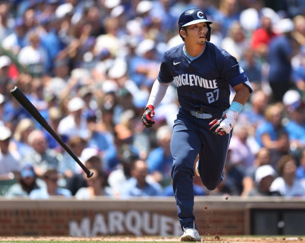 Cubs right fielder Seiya Suzuki tosses his bat aside as he flies out to right field in the first inning against the Diamondbacks on July 19, 2024, at Wrigley Field. (Chris Sweda/Chicago Tribune)