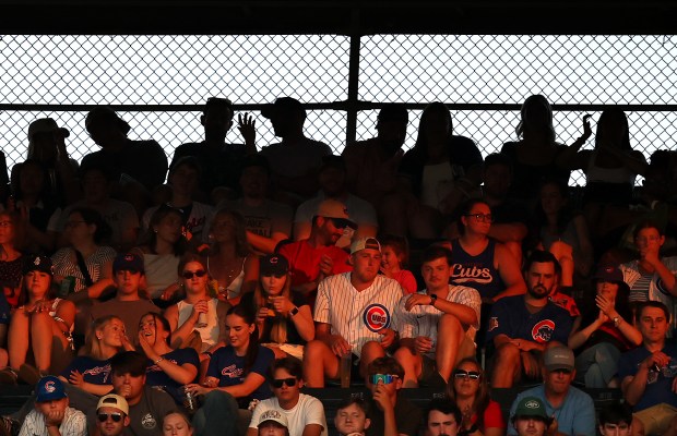 The setting sun is cast on a section of the upper deck at Wrigley Field in Chicago in the fifth inning of a game between the Chicago Cubs and the Arizona Diamondbacks on July 20, 2024. (Chris Sweda/Chicago Tribune)