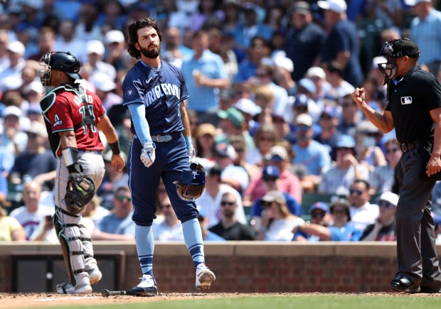 Cubs shortstop Dansby Swanson tosses his helmet aside after striking out to end the fourth inning on July 19, 2024, at Wrigley Field. (Chris Sweda/Chicago Tribune)