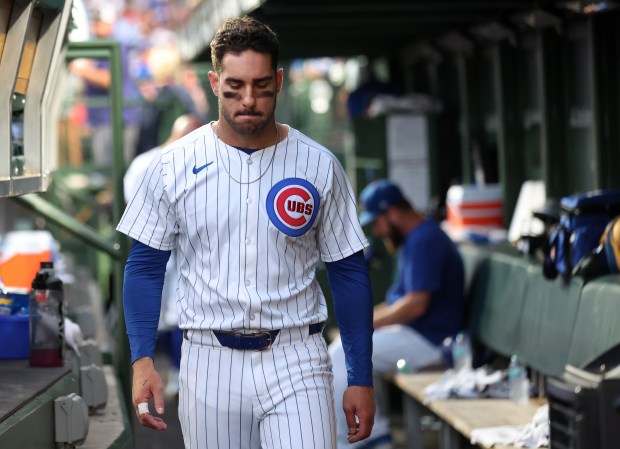 Chicago Cubs designated hitter Mike Tauchman walks through the dugout after grounding out with the bases loaded to end the fifth inning of a game against the Arizona Diamondbacks at Wrigley Field in Chicago on July 20, 2024. (Chris Sweda/Chicago Tribune)