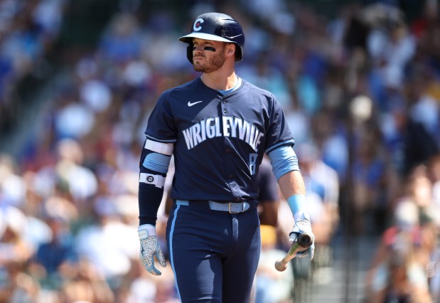 Cubs left fielder Ian Happ walks to the dugout after striking out in the sixth inning on July 19, 2024, at Wrigley Field. (Chris Sweda/Chicago Tribune)