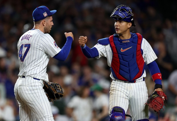 Chicago Cubs relief pitcher Hunter Bigge and catcher Miguel Amaya celebrate after shutting down the Arizona Diamondbacks in the 9th inning of a game at Wrigley Field in Chicago on July 20, 2024. (Chris Sweda/Chicago Tribune)