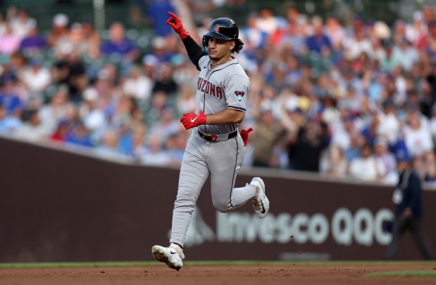 Arizona Diamondbacks outfielder Alek Thomas celebrates as he rounds the bases after hitting a solo home run in the fifth inning of a game against the Chicago Cubs at Wrigley Field in Chicago on July 20, 2024. (Chris Sweda/Chicago Tribune)