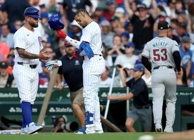 Chicago Cubs third baseman Christopher Morel takes off his helmet after grounding into a fielder's choice to end the third inning of a game against the Arizona Diamondbacks at Wrigley Field in Chicago on July 20, 2024. (Chris Sweda/Chicago Tribune)