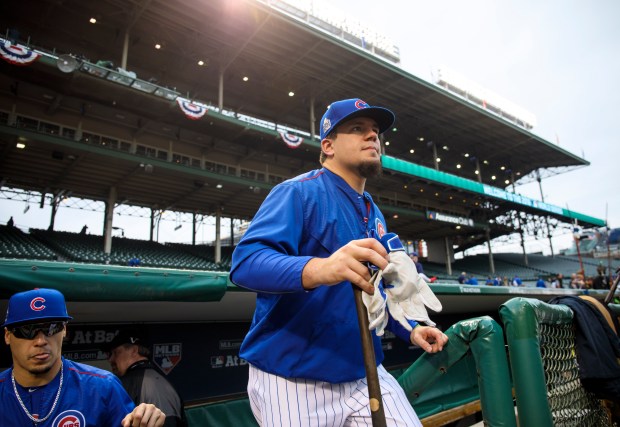 Chicago Cubs designated hitter Kyle Schwarber (12) takes the field Saturday, Oct. 29, 2016 before Game 4 of the World Series at Wrigley Field. (Brian Cassella/Chicago Tribune)