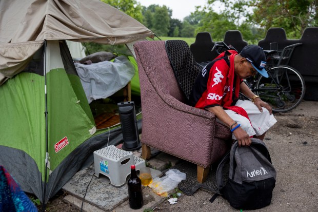 Cesar Dil at a homeless encampment along the North Shore Channel between Bryn Mawr and Foster avenues, June 20, 2024. (Vincent Alban/Chicago Tribune)