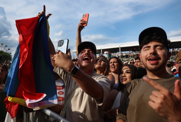 People react as Ryan Castro performs at Miche Fest at Oakwood Beach in Chicago on July 13, 2024. (Chris Sweda/Chicago Tribune)