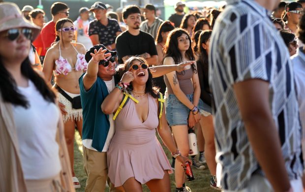 A couple dances to the music at Miche Fest at Oakwood Beach in Chicago on July 13, 2024. (Chris Sweda/Chicago Tribune)