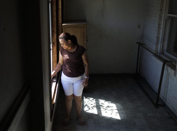 Karina Fuentes looks at the backyard of her home in the New City neighborhood on June 14, 2024 in Chicago. (Armando L. Sanchez/Chicago Tribune)