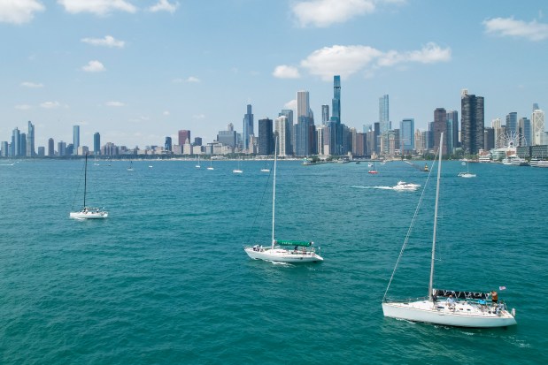 Boats participating in the Race to Mackinac pass by Navy Pier at the start of the race on Saturday, July 13, 2024, in Chicago. (Vincent Alban/for Chicago Tribune)