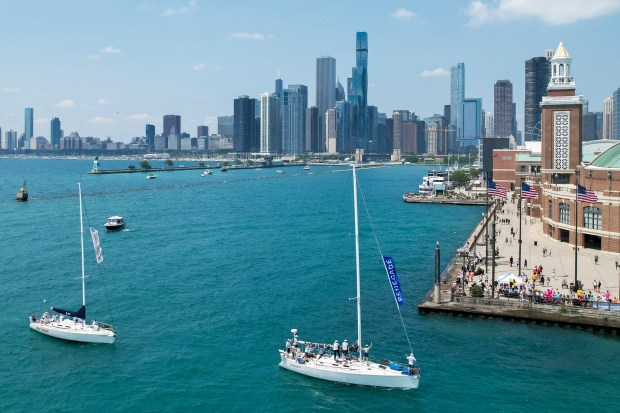 Boats participating in the Race to Mackinac pass by Navy Pier at the start of the race on Saturday, July 13, 2024, in Chicago. (Vincent Alban/for Chicago Tribune)