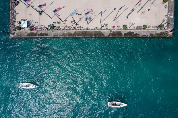 Boats participating in the Race to Mackinac pass by Navy Pier at the start of the race on Saturday, July 13, 2024, in Chicago. (Vincent Alban/for Chicago Tribune)