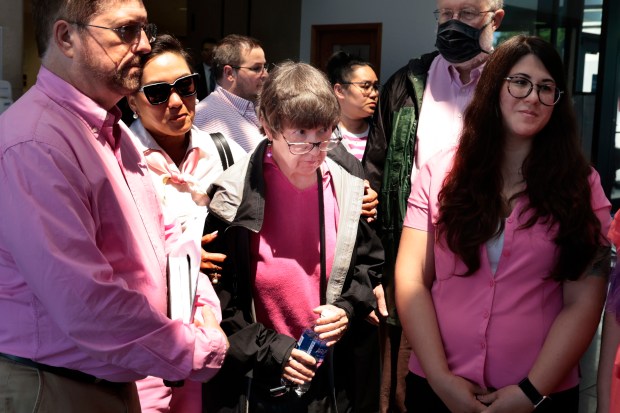 Family members of the victim, Frances Walker, including her sister, Benita Walker, center, leave after speaking with media following the sentencing for Sandra Kolalou, 37, at the Dirksen Criminal Courthouse on July 10, 2024. (Antonio Perez/Chicago Tribune)