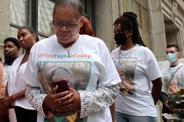 Colette Seymore, mother of missing person Taylor Casey, stands with family and supporters outside Chicago City Hall, July 11, 2024. (Antonio Perez/Chicago Tribune)