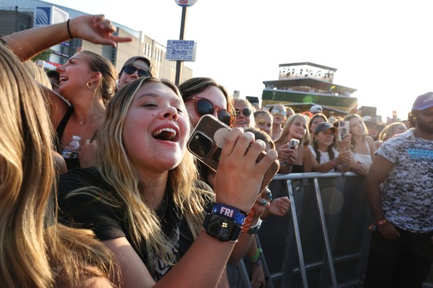 Fans cheer as Lee Brice performs at the annual Windy City Smokeout outside of the United Center in Chicago on Friday, July 12, 2024. (Chris Sweda/Chicago Tribune)