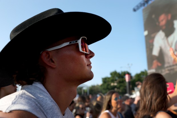 A fan takes in a set by DJ Pauly D at the annual Windy City Smokeout outside of the United Center in Chicago on Friday, July 12, 2024. (Chris Sweda/Chicago Tribune)