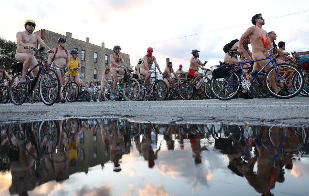 People participate in the World Naked Bike Ride through Chicago on June 29, 2024. (Chris Sweda/Chicago Tribune)