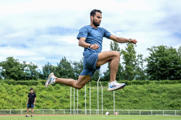 Syrian refugee Mohammad Amin Alsalami, 29, trains at the Wilmersdorf Stadium in Berlin on May 29, 2024. (AP Photo/Ebrahim Noroozi)