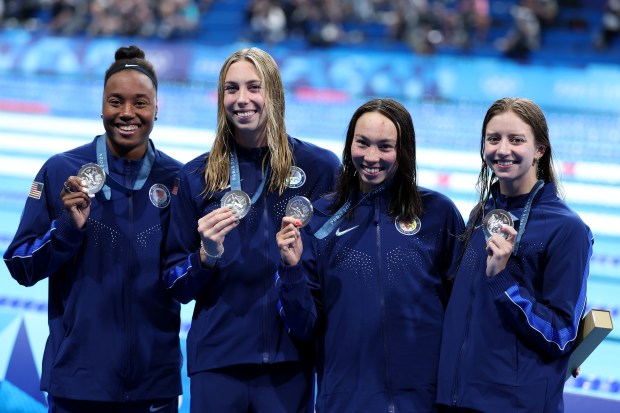 Silver Medalists, Kate Douglass, Gretchen Walsh, Torri Huske and Simone Manuel of Team United States pose with their medals following the Medal Ceremony after the Women's 4x100m Freestyle Relay Final on day one of the Olympic Games Paris 2024 at Paris La Defense Arena on July 27, 2024 in Nanterre, France. (Photo by Al Bello/Getty Images)