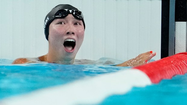 Torri Huske, of the United States, reacts after winning the women's 100-meter butterfly final at the 2024 Summer Olympics, Sunday, July 28, 2024, in Nanterre, France. (AP Photo/Matthias Schrader)