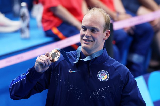 Bronze Medalist Luke Hobson of Team United States poses following the Swimming medal ceremony after the Men's 200m Freestyle Final on day three of the Olympic Games Paris 2024 at Paris La Defense Arena on July 29, 2024 in Nanterre, France. (Photo by Buda Mendes/Getty Images)