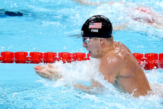 Nic Fink of Team United States competes in the Men's 100m Breaststroke Final on day two of the Olympic Games Paris 2024 at Paris La Defense Arena on July 28, 2024 in Nanterre, France. (Photo by Lintao Zhang/Getty Images)