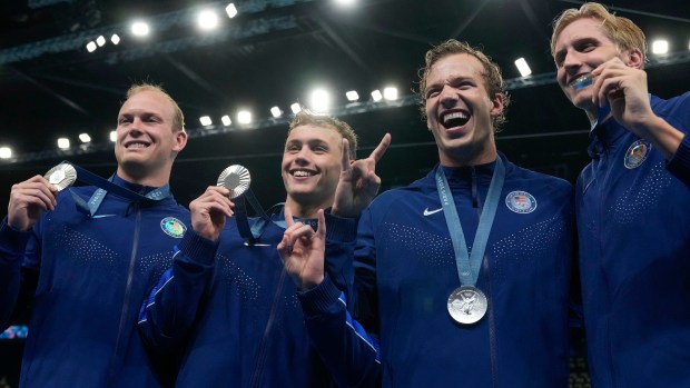 United States' men's 4x200-meter freestyle relay team pose with their silver medals at the 2024 Summer Olympics, Tuesday, July 30, 2024, in Nanterre, France. (AP Photo/Matthias Schrader)