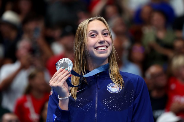 Silver Medalist Gretchen Walsh of Team United States poses on the podium during the Swimming medal ceremony after the Women's 100m Butterfly Final on day two of the Olympic Games Paris 2024 at Paris La Defense Arena on July 28, 2024 in Nanterre, France. (Photo by Quinn Rooney/Getty Images)