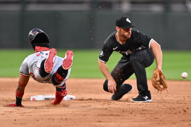 The Twins' Willi Castro dives into second base unsuccessfully trying to stretch a single against Paul DeJong in the fifth inning at Guaranteed Rate Field on July 8, 2024. DeJong tagged out Castro at second base. (Photo by Jamie Sabau/Getty Images)