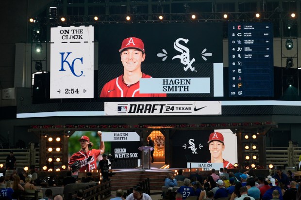 A photo of Hagen Smith is shown on the video board after the White Sox selected him with the fifth pick in the MLB draft on Sunday, July 14, 2024, in Fort Worth, Texas. (AP Photo/LM Otero)