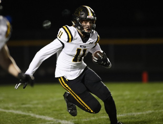 Metea Valley's Jalen Johnson (11) returns a kick against Neuqua Valley during a game on Friday, April 23, 2021.