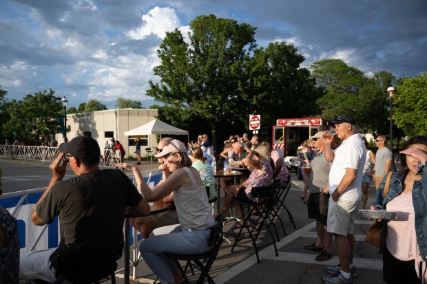 Spectators line the race route during the 2023 West Dundee River Classic, one day in the 10-day Chicago Grit Series, formerly known as the Intelligentsia Cup cycling series. (Ethan Glading