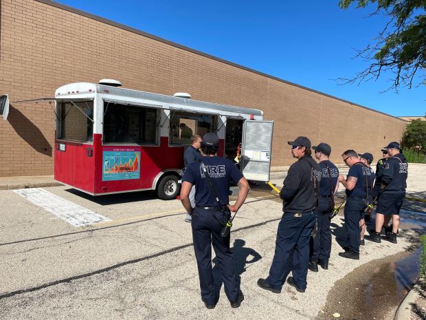 West Dundee firefighters gather outside the former Spring Hill Mall in West Dundee to get instructions on a training exercise that will allow them to experience what it's like to handle an emergency situation in a large space like a shopping center. (West Dundee Fire Department)