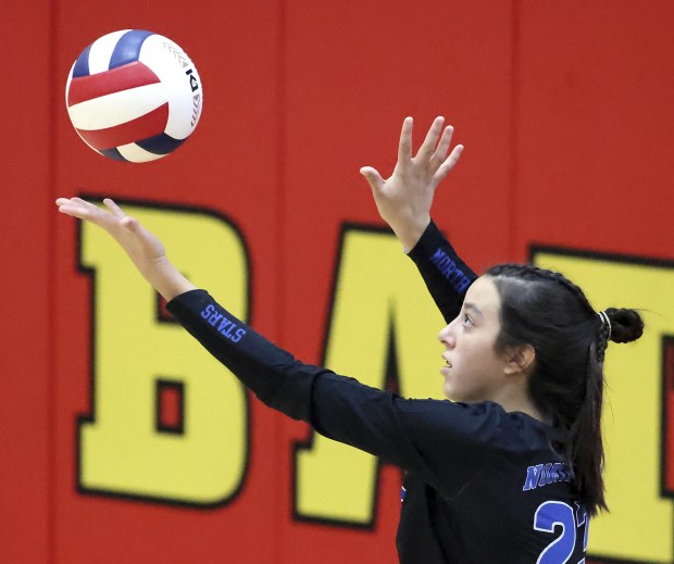 St. Charles North's Haley Burgdorf (23) serves against Batavia during a DuKane Conference match in Batavia on Tuesday, Oct. 18, 2022