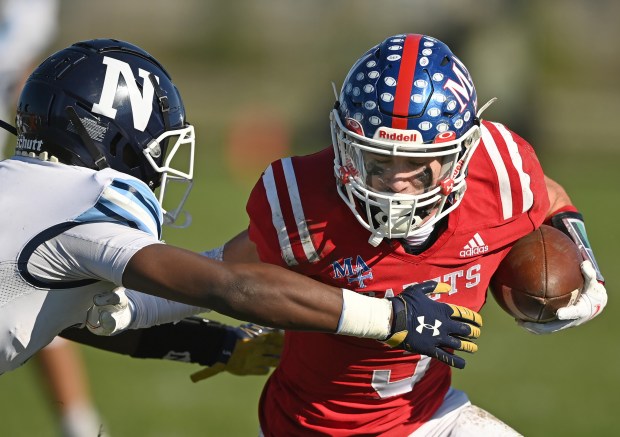 Marmion's Dane Pardridge (3) turns up field against Nazareth after pulling in a short pass during the second quarter of a Class 5A second-round playoff game on Saturday, Nov. 6, 2021.