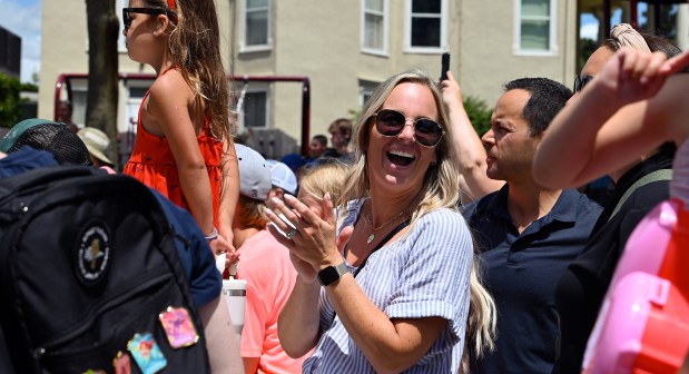 Center, Kari Le of Libertyville claps as part of the audience on July 5, 2024 at the Dog Days of Summer hosted by the Knights of Columbus (Council #3674). (Karie Angell Luc/Lake County News-Sun)