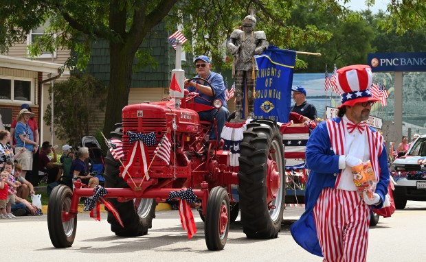 The St. Bede Pius X Council 3788 Knights of Columbus of Our Lake of the Lakes St. Bede Campus of Ingleside is among parade entries during the Village of Fox Lake Celebrate Fox Lake Parade on June 29, 2024. (Karie Angell Luc/Lake County News-Sun)