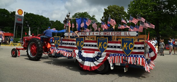 The St. Bede Pius X Council 3788 Knights of Columbus of Our Lake of the Lakes St. Bede Campus of Ingleside is among parade entries during the Village of Fox Lake Celebrate Fox Lake Parade on June 29, 2024. (Karie Angell Luc/Lake County News-Sun)