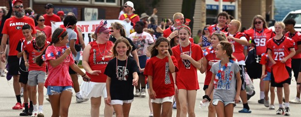 The Grant Jr. Bulldogs Cheer and Grant Jr. Bulldogs program youth appear on Grand Avenue during the Village of Fox Lake Celebrate Fox Lake Parade on June 29, 2024. (Karie Angell Luc/Lake County News-Sun)